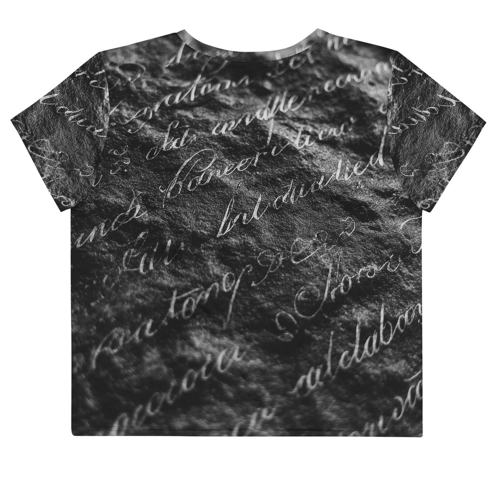 Flat studio mockup of Form Finding Design “Women’s Era Print (No.11)” crop tee, back — monochrome handwritten script collage across body and sleeves; crew neck, cropped hem; The Signature Collective.