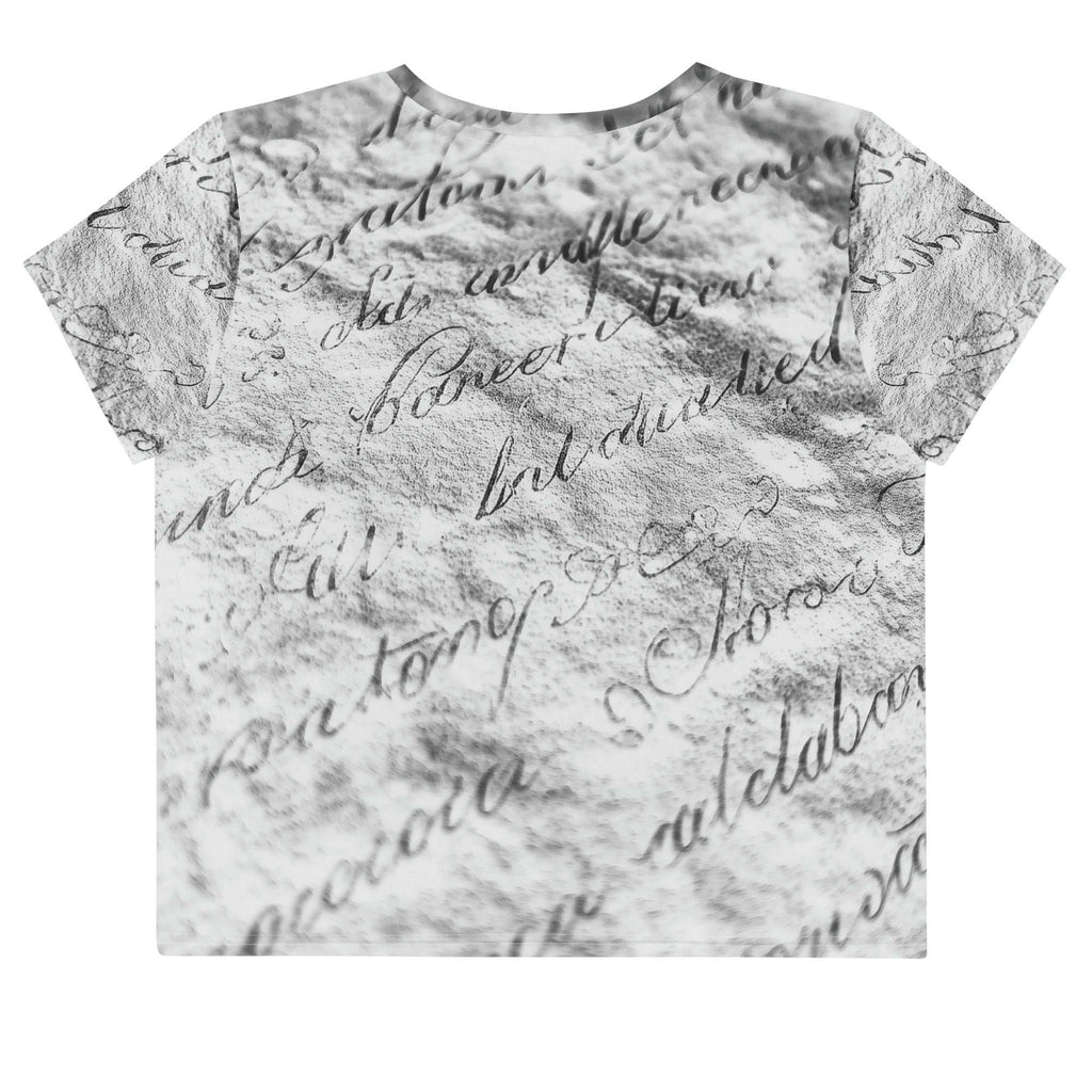 Flat studio mockup of Form Finding Design “Women’s Era Print (No.12)” crop tee, back — monochrome handwritten script collage across body and sleeves; crew neck, cropped hem; The Signature Collective.