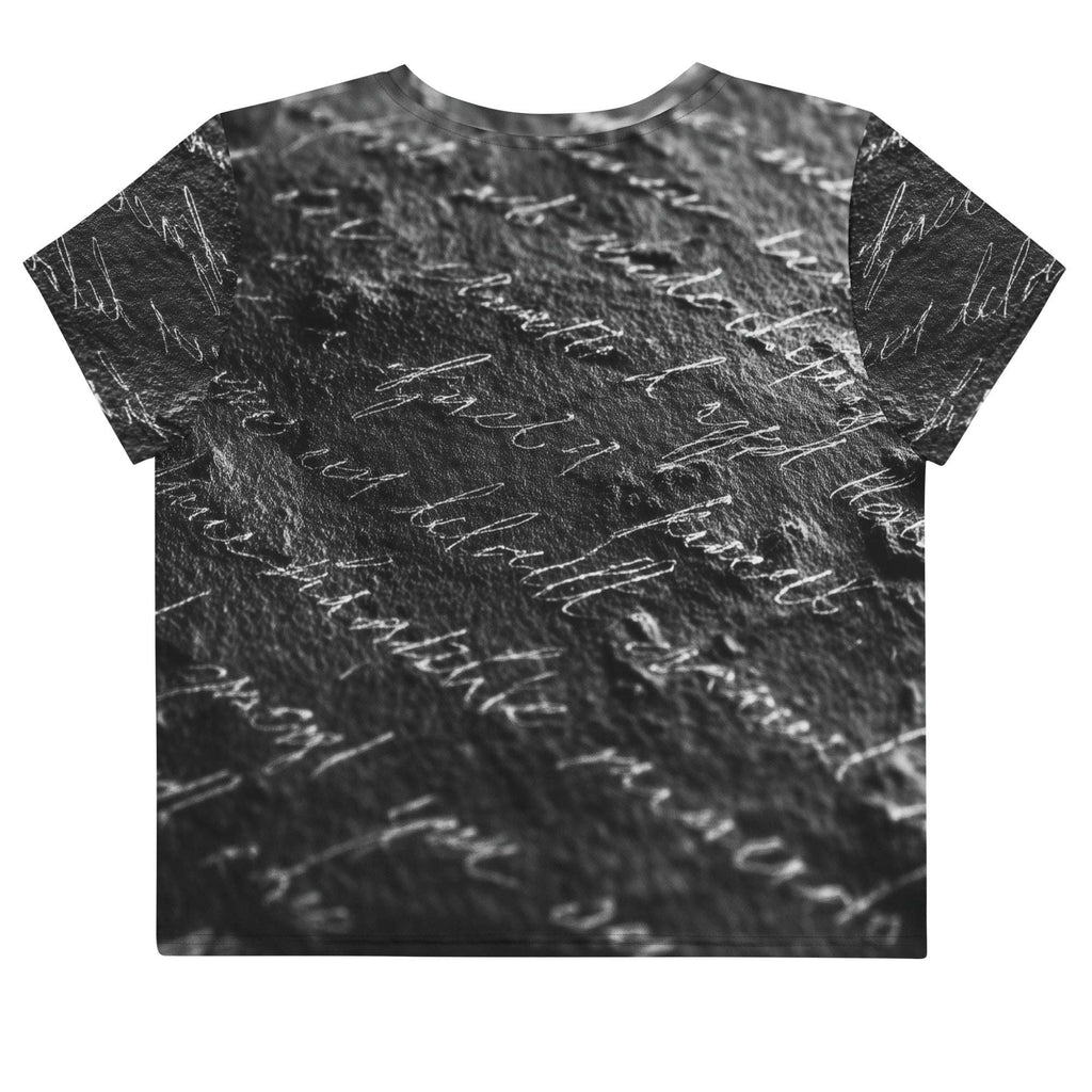 Flat studio mockup of Form Finding Design “Women’s Era Print (No.13)” crop tee, back — monochrome handwritten script collage across body and sleeves; crew neck, cropped hem; The Signature Collective.