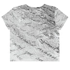 Flat studio mockup of Form Finding Design “Women’s Era Print (No.14)” crop tee, back — monochrome handwritten script collage across body and sleeves; crew neck, cropped hem; The Signature Collective.