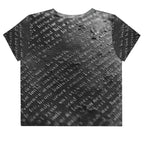 Flat studio mockup of Form Finding Design “Women’s Era Print (No.15)” crop tee, back — monochrome handwritten script collage across body and sleeves; crew neck, cropped hem; The Signature Collective.