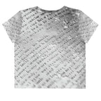 Flat studio mockup of Form Finding Design “Women’s Era Print (No.16)” crop tee, back — monochrome handwritten script collage across body and sleeves; crew neck, cropped hem; The Signature Collective.