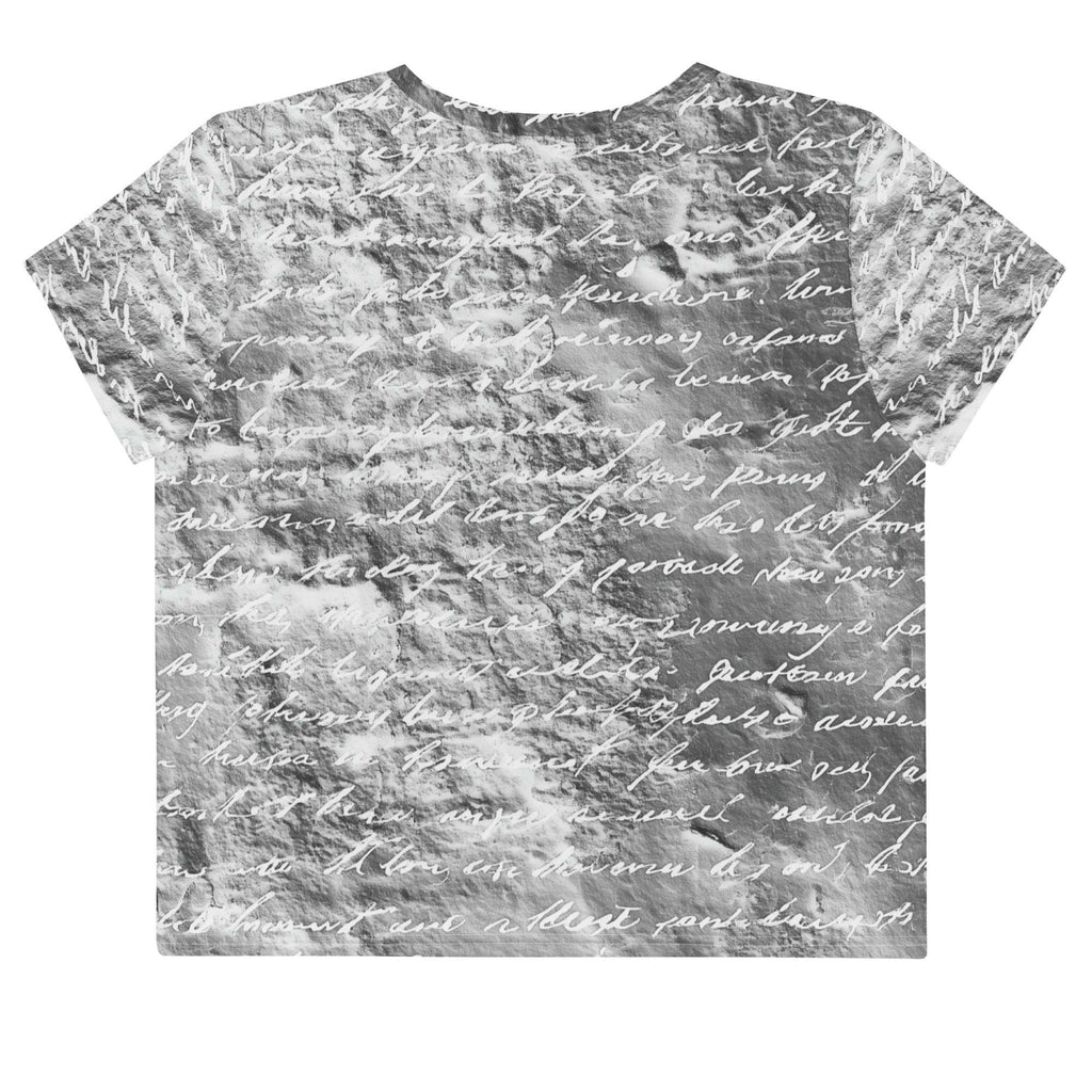 Flat studio mockup of Form Finding Design “Women’s Era Print (No.18)” crop tee, back — monochrome handwritten script collage across body and sleeves; crew neck, cropped hem; The Signature Collective.