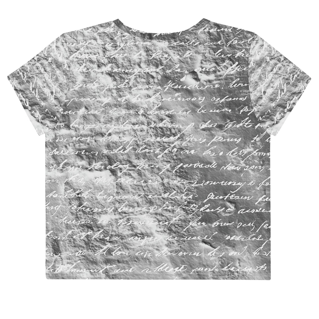 Flat studio mockup of Form Finding Design “Women’s Era Print (No.18)” crop tee, back — monochrome handwritten script collage across body and sleeves; crew neck, cropped hem; The Signature Collective.