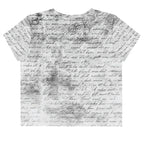 Flat studio mockup of Form Finding Design “Women’s Era Print (No.20)” crop tee, back — monochrome handwritten script collage across body and sleeves; crew neck, cropped hem; The Signature Collective.