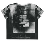 Back view of Women's Era Stamp (No.05) crop top with bold black and white geometries, distressed ink texture, crew neck, short sleeves.