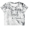 Flat studio mockup of Form Finding Design “Women’s Era Print (No.08)” crop tee, front — monochrome handwritten script collage across body and sleeves; crew neck, cropped hem; The Signature Collective.