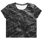 Flat studio mockup of Form Finding Design “Women’s Era Print (No.11)” crop tee, front — monochrome handwritten script collage across body and sleeves; crew neck, cropped hem; The Signature Collective.