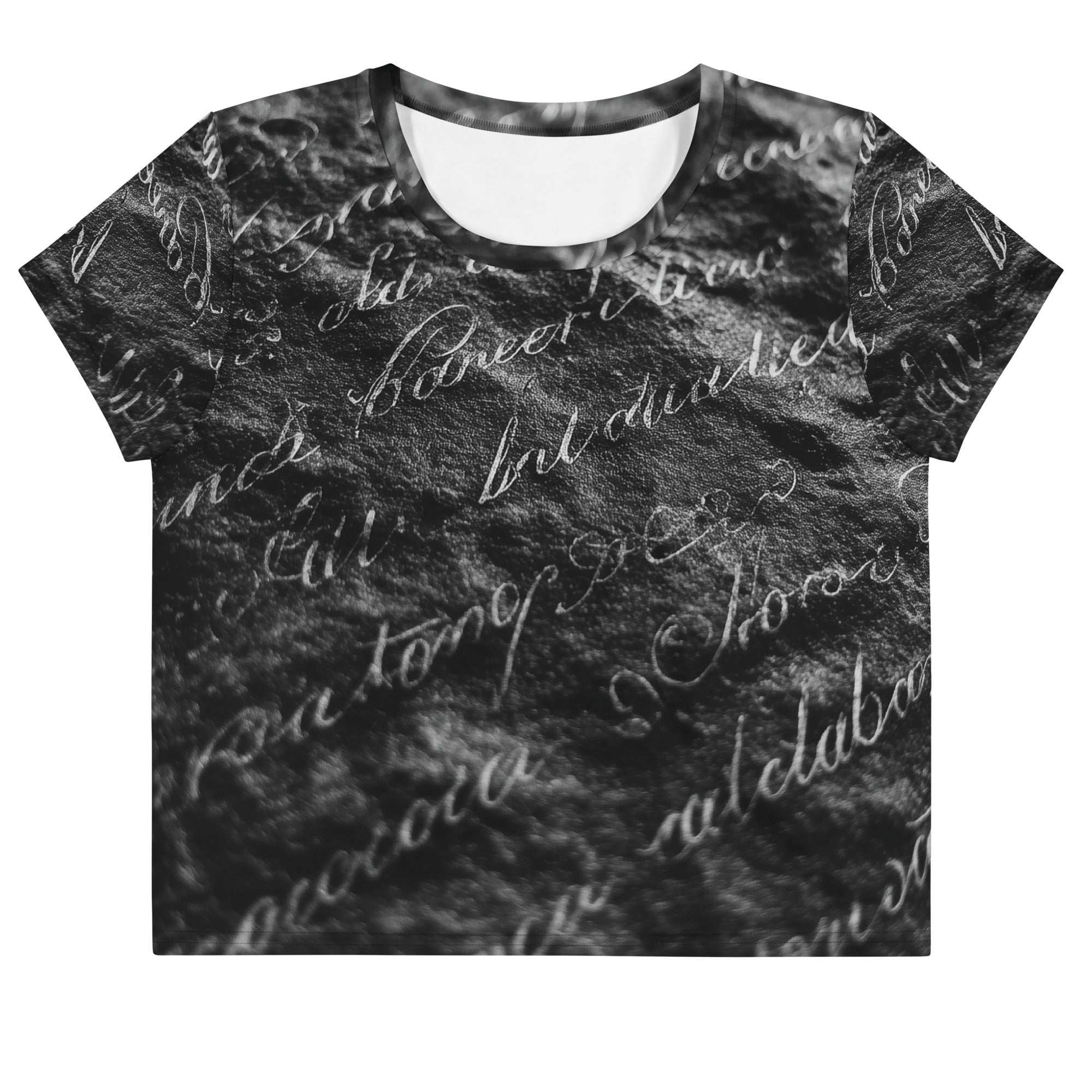 Flat studio mockup of Form Finding Design “Women’s Era Print (No.11)” crop tee, front — monochrome handwritten script collage across body and sleeves; crew neck, cropped hem; The Signature Collective.