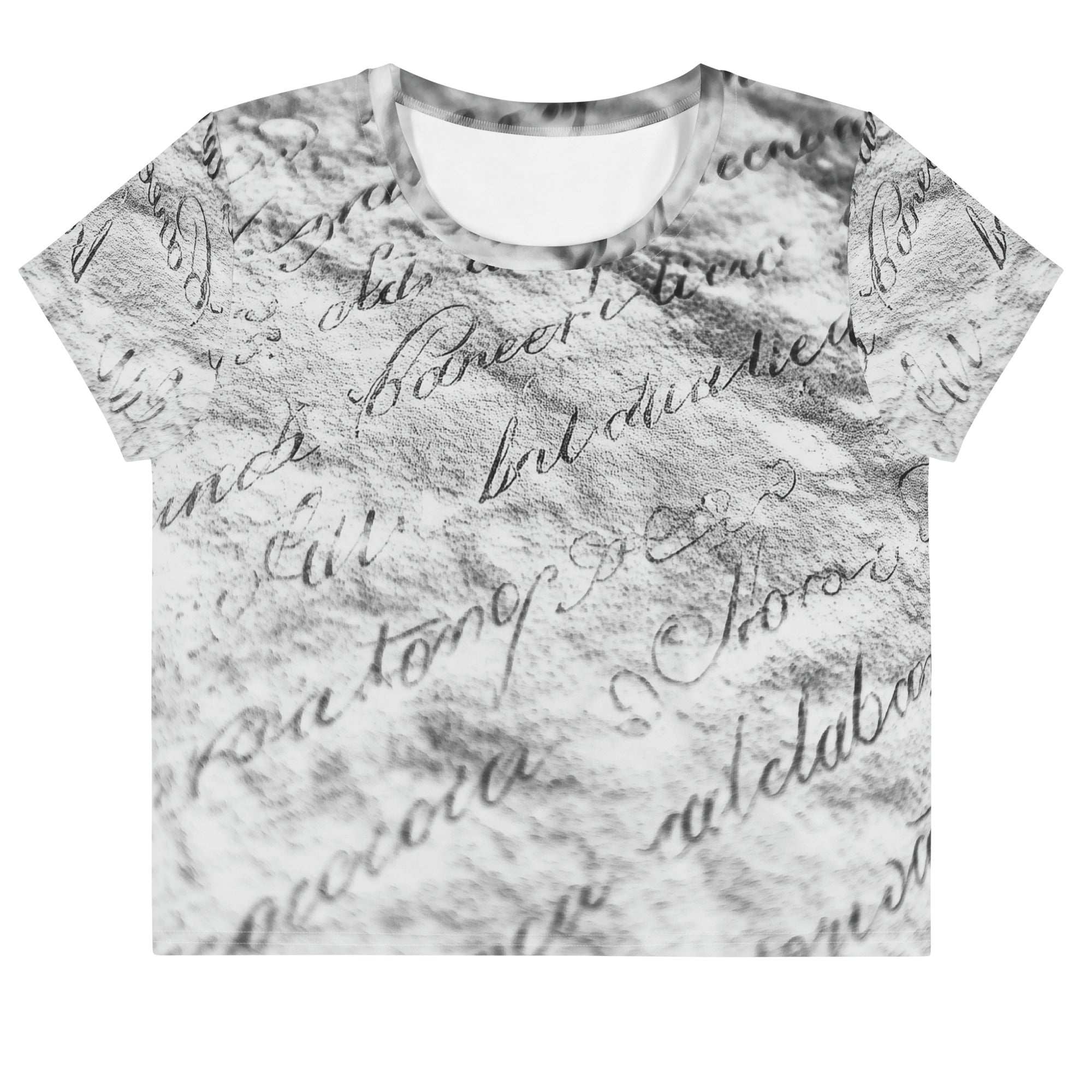 Flat studio mockup of Form Finding Design “Women’s Era Print (No.12)” crop tee, front — monochrome handwritten script collage across body and sleeves; crew neck, cropped hem; The Signature Collective.