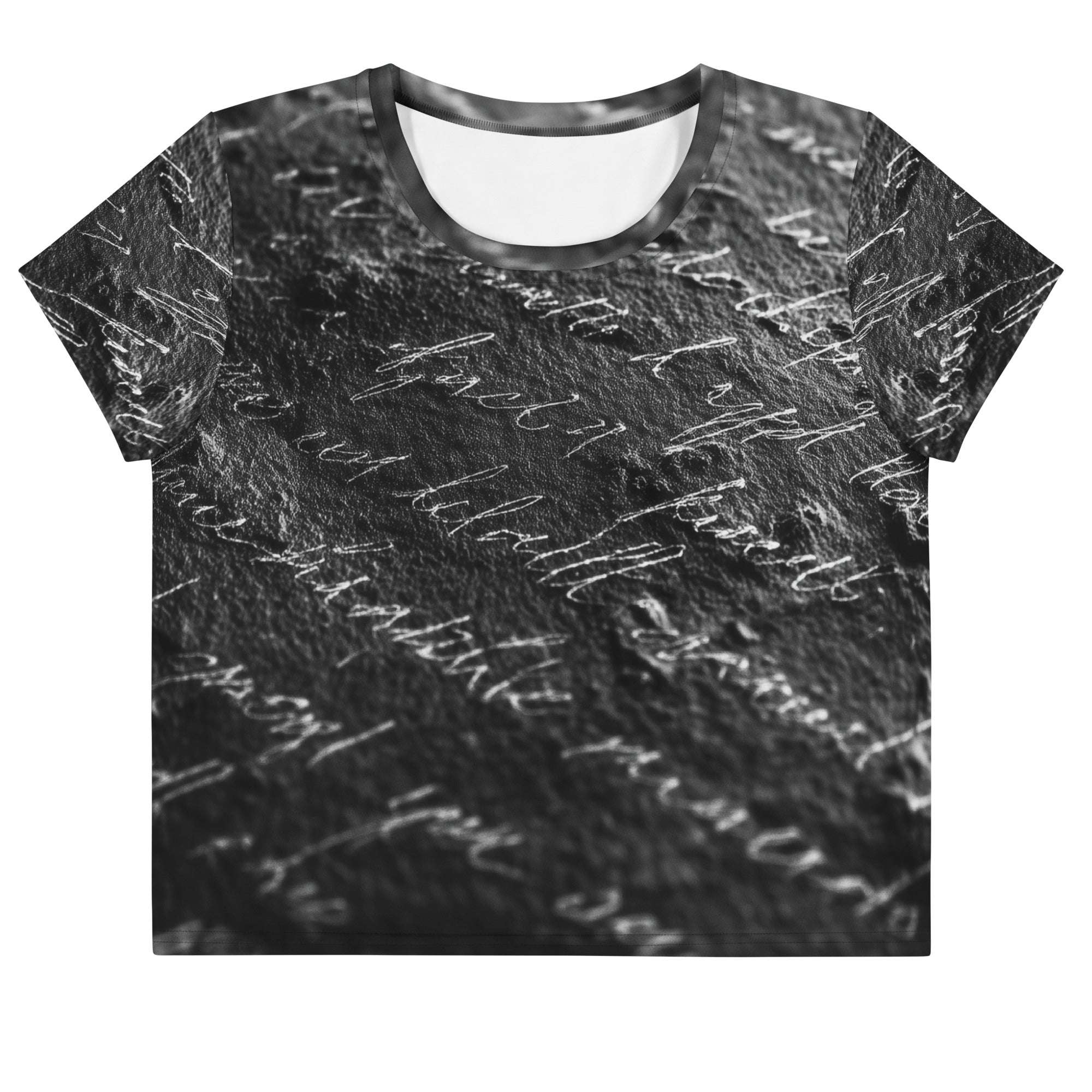 Flat studio mockup of Form Finding Design “Women’s Era Print (No.13)” crop tee, front — monochrome handwritten script collage across body and sleeves; crew neck, cropped hem; The Signature Collective.
