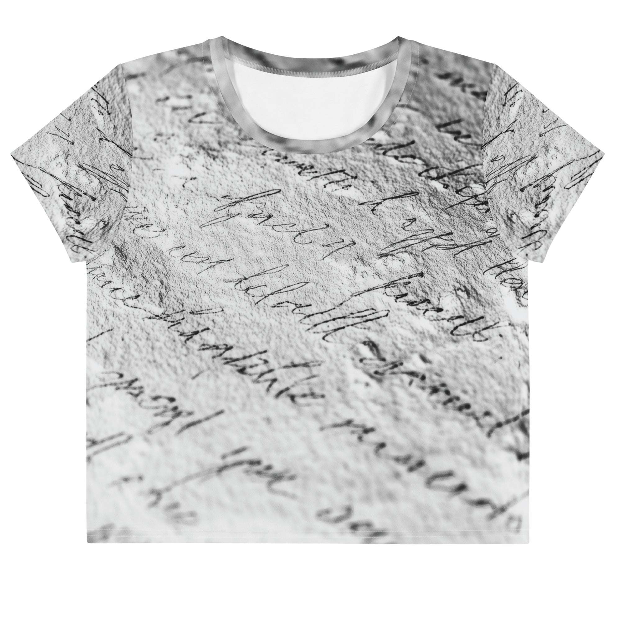 Flat studio mockup of Form Finding Design “Women’s Era Print (No.14)” crop tee, front — monochrome handwritten script collage across body and sleeves; crew neck, cropped hem; The Signature Collective.