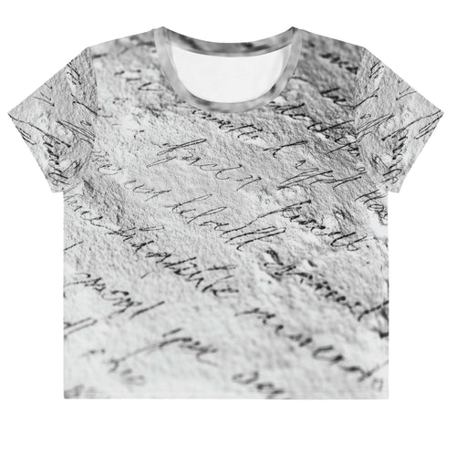 Flat studio mockup of Form Finding Design “Women’s Era Print (No.14)” crop tee, front — monochrome handwritten script collage across body and sleeves; crew neck, cropped hem; The Signature Collective.