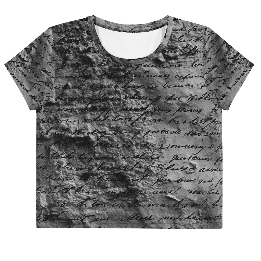 Flat studio mockup of Form Finding Design “Women’s Era Print (No.17)” crop tee, front — monochrome handwritten script collage across body and sleeves; crew neck, cropped hem; The Signature Collective.
