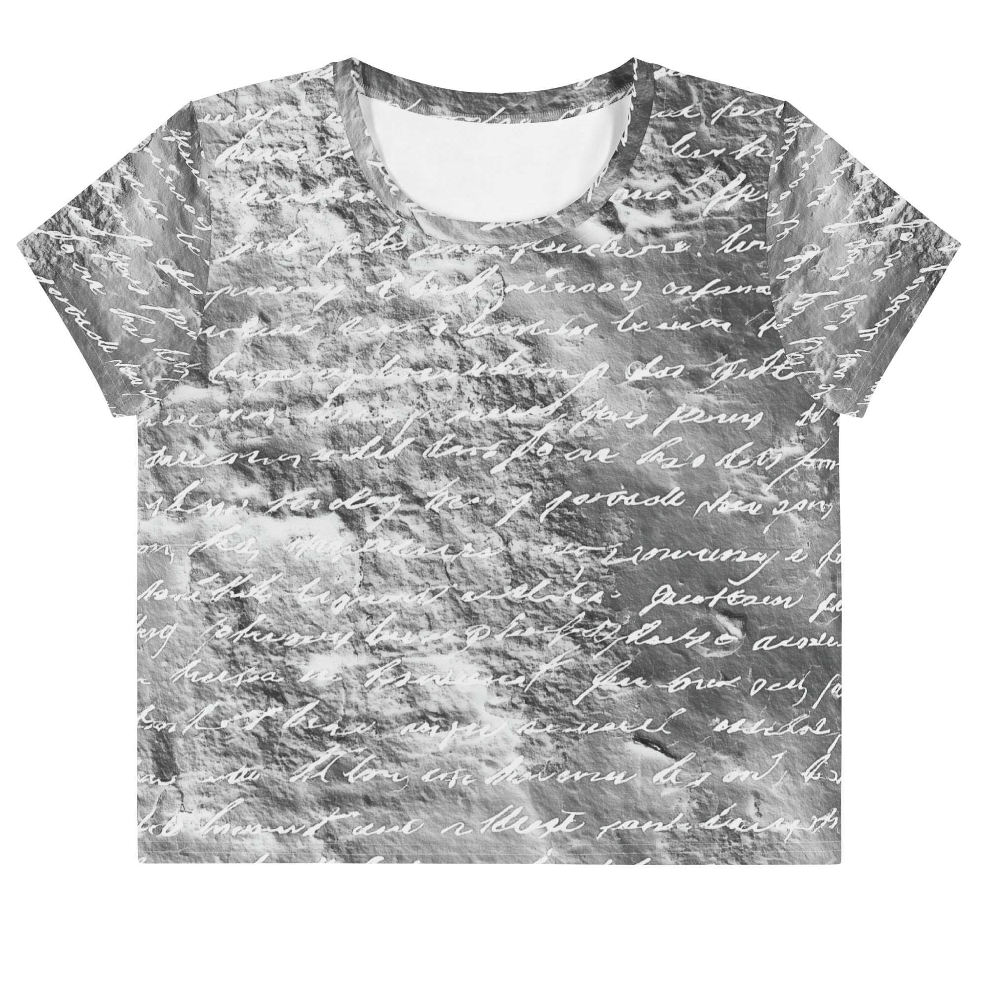 Flat studio mockup of Form Finding Design “Women’s Era Print (No.18)” crop tee, front — monochrome handwritten script collage across body and sleeves; crew neck, cropped hem; The Signature Collective.