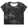 Flat studio mockup of Form Finding Design “Women’s Era Print (No.19)” crop tee, front — monochrome handwritten script collage across body and sleeves; crew neck, cropped hem; The Signature Collective.