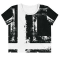 Front view of Women's Era Stamp (No.02) crop top with bold black and white geometries, distressed ink texture, crew neck, short sleeves.