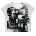 Front view of Women's Era Stamp (No.18) crop top with bold black and white geometries, distressed ink texture, crew neck, short sleeves.