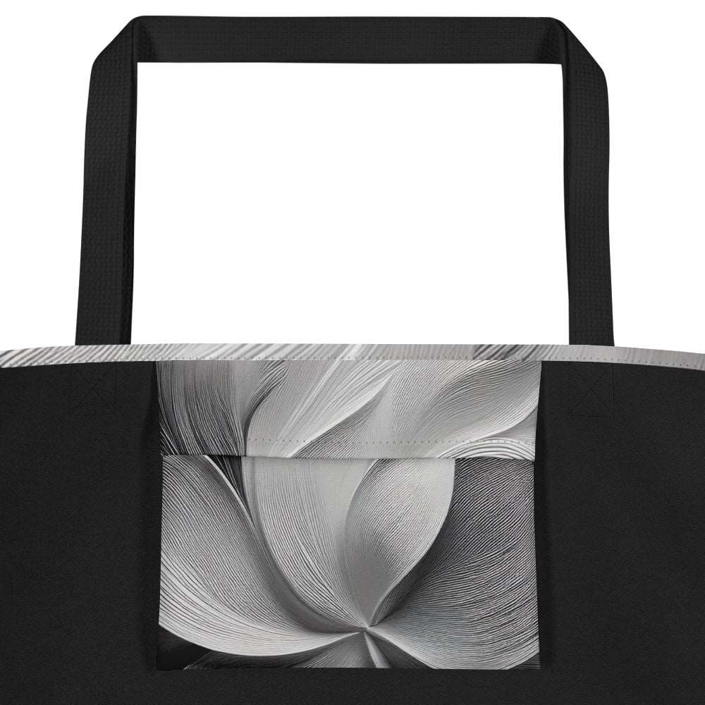 Interior detail of Silver Bloom Tote Bag showing large inside pocket lined with the same abstract greyscale Silver Bloom print, black polyester body and sturdy cotton webbing handles – practical designer-infused tote for everyday carry and beach essentials from Form Finding Design.