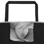 Interior detail of Silver Bloom Tote Bag showing large inside pocket lined with the same abstract greyscale Silver Bloom print, black polyester body and sturdy cotton webbing handles – practical designer-infused tote for everyday carry and beach essentials from Form Finding Design.
