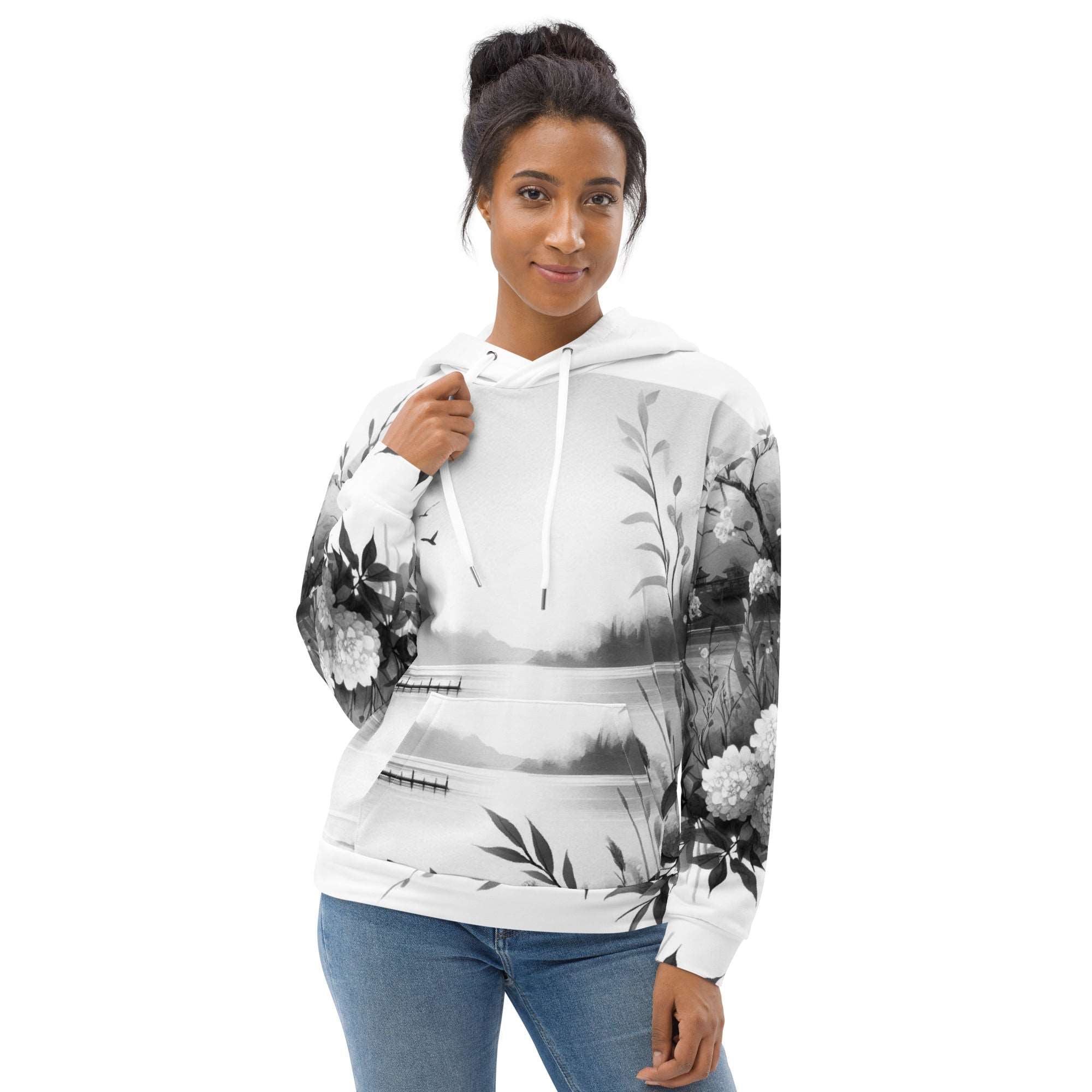 “Women’s Watercolour-Print-9 Muse Hoodie side model in white with gray hand-painted landscape design, featuring abstract mountains and trees, kangaroo pocket, and adjustable drawstring hood.”