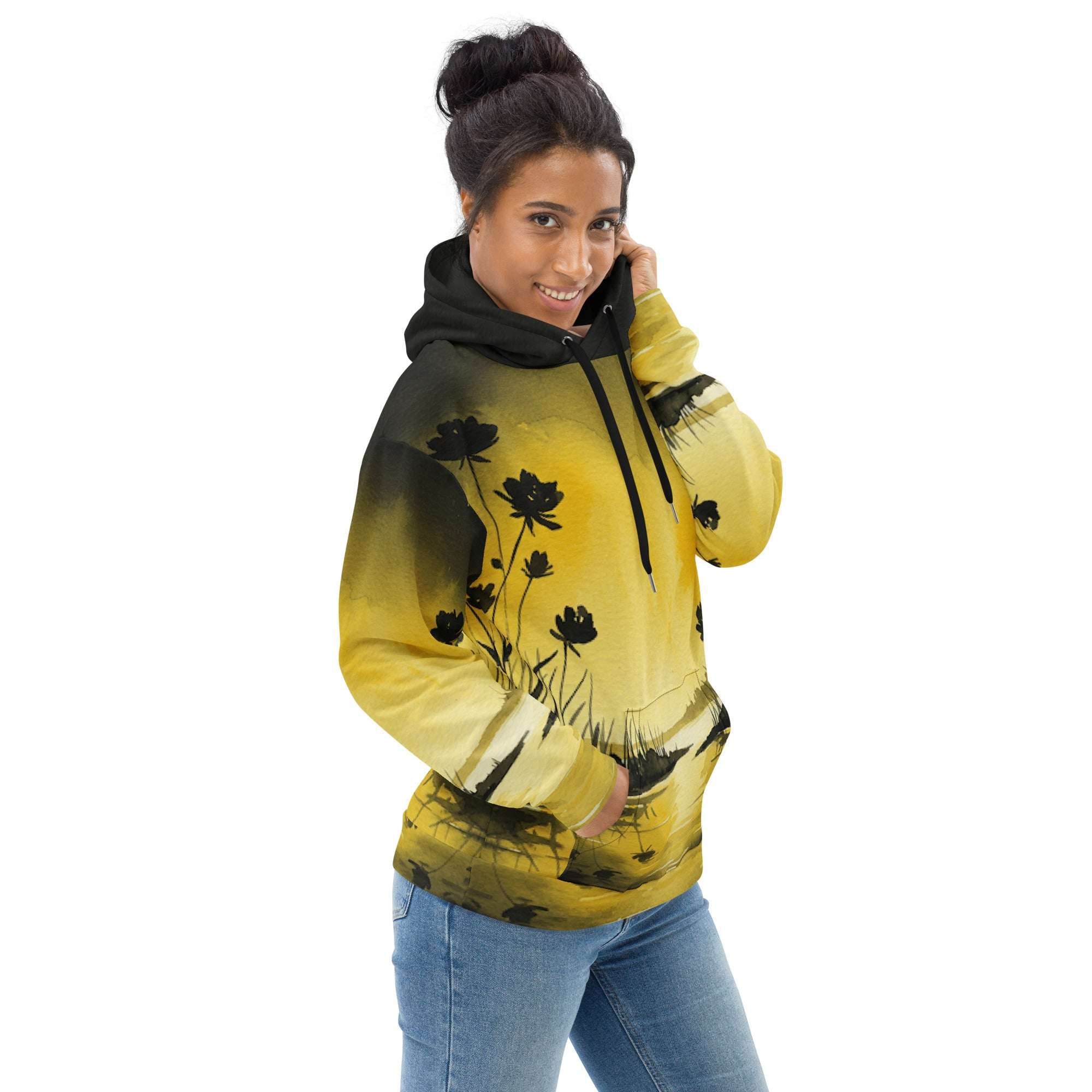 An FFD Luminescence-2 hoodie (side model pose) with a black, white and yellow gradient print of a nature-inspired design featuring hues of white yellow and black tones.