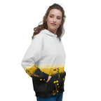An FFD Luminescence hoodie (side model pose) with a black, white and yellow gradient print of a nature-inspired design featuring hues of white yellow and black tones.
