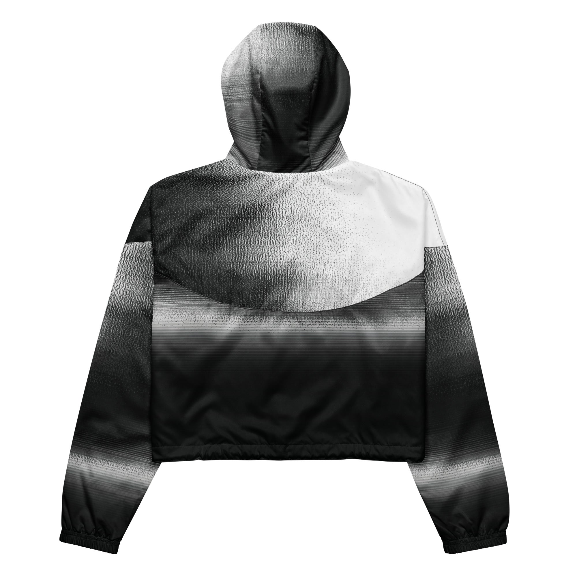Back studio view of the HER Cropped Dither Distortion Windbreaker, showing the hood and cropped silhouette. The digital distortion print runs from light grey at the upper back to deep charcoal at the hem; the hood’s outer panels are colour‑blocked in black and white, and the elasticated hem is cinched with a drawcord, all set against a clean white backdrop