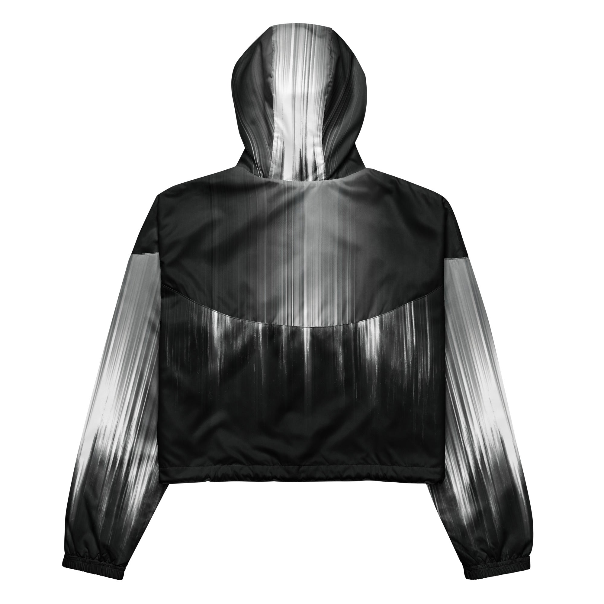 Back studio view of the HER Cropped Dither Distortion Windbreaker (No.02), showing the hood and cropped silhouette. The digital distortion print runs from light grey at the upper back to deep charcoal at the hem; the hood’s outer panels are colour‑blocked in black and white, and the elasticated hem is cinched with a drawcord, all set against a clean white backdrop