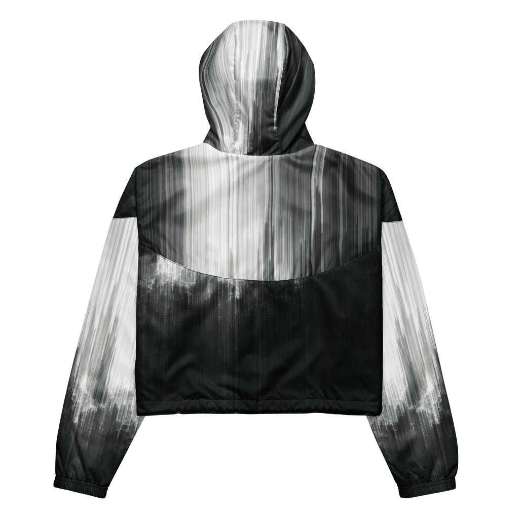 Back studio view of the HER Cropped Dither Distortion Windbreaker (No.06), showing the hood and cropped silhouette. The digital distortion print runs from light grey at the upper back to deep charcoal at the hem; the hood’s outer panels are colour‑blocked in black and white, and the elasticated hem is cinched with a drawcord, all set against a clean white backdrop
