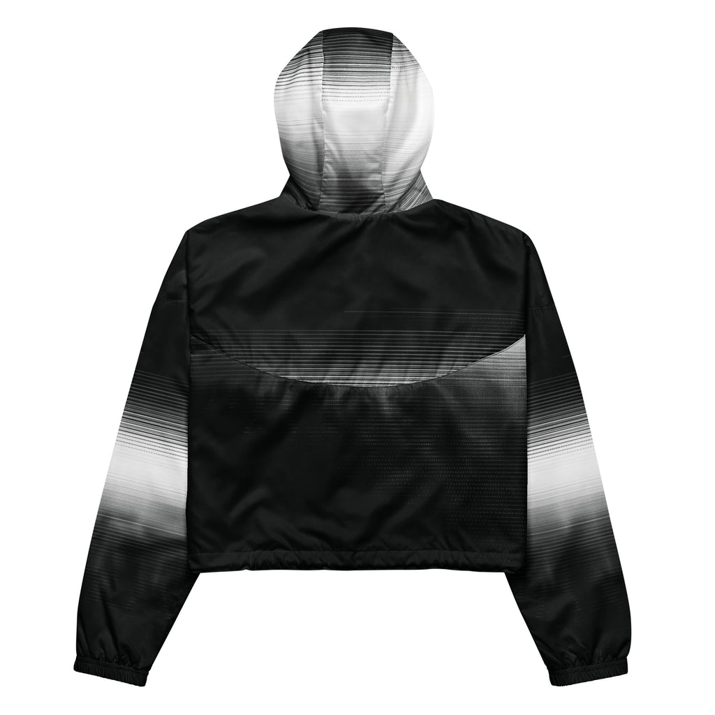 Back studio view of the HER Cropped Dither Distortion Windbreaker (No.09), showing the hood and cropped silhouette. The digital distortion print runs from light grey at the upper back to deep charcoal at the hem; the hood’s outer panels are colour‑blocked in black and white, and the elasticated hem is cinched with a drawcord, all set against a clean white backdrop