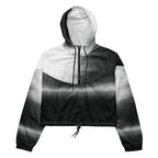 HER Cropped Dither Distortion Windbreaker by Form Finding Design, front studio view — cropped hooded jacket with a monochrome graphic distortion print fading from white at the shoulders to dark charcoal at the hem. Features a half‑zip front, black drawstrings, long sleeves and an elasticated hem with a drawcord, displayed on a plain white background