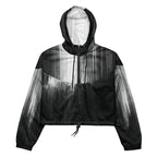 HER Cropped Dither Distortion Windbreaker (No.06) by Form Finding Design, front studio view — cropped hooded jacket with a monochrome graphic distortion print fading from white at the shoulders to dark charcoal at the hem. Features a half‑zip front, black drawstrings, long sleeves and an elasticated hem with a drawcord, displayed on a plain white background