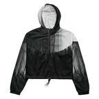 HER Cropped Dither Distortion Windbreaker (No.10) by Form Finding Design, front studio view — cropped hooded jacket with a monochrome graphic distortion print fading from white at the shoulders to dark charcoal at the hem. Features a half‑zip front, black drawstrings, long sleeves and an elasticated hem with a drawcord, displayed on a plain white background