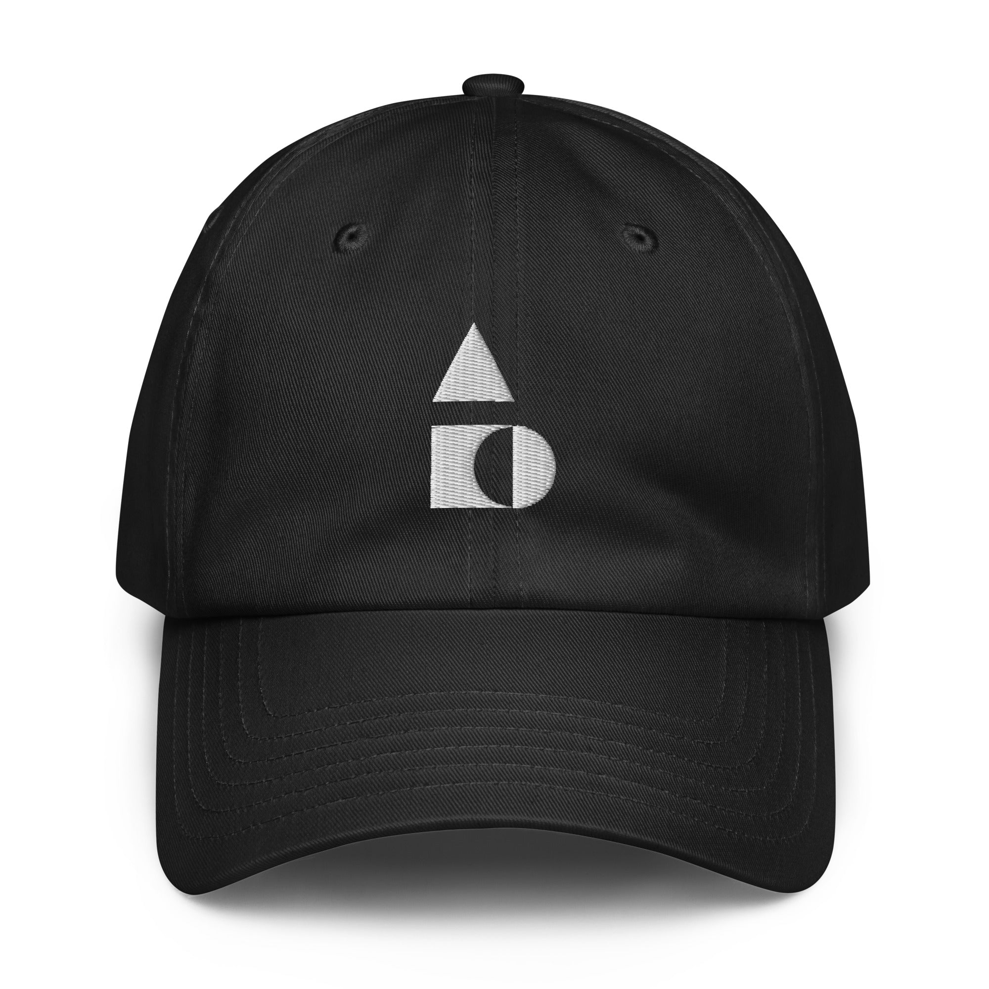 A crisp front view of the black Under Armour x Form Fundamentals Stamp Cap (No.04), showing its six‑panel construction, curved brim and the white geometric Form Fundamentals logo embroidered on the front.
