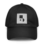 A crisp front view of the black Under Armour x Form Fundamentals Stamp Cap (No.12), showing its six‑panel construction, curved brim and the white geometric Form Fundamentals logo embroidered on the front.