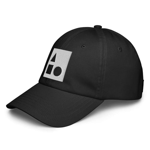 Three‑quarter side view of the black Under Armour x Form Fundamentals Stamp Cap (No.18), highlighting the curved pre‑curved brim, clean six‑panel crown and white geometric Form Fundamentals emblem on the front panel.