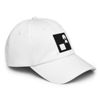 Detailed close‑up of the white Under Armour x Form Fundamentals Stamp Cap (No.15), focusing on the fine fabric texture, stitched seams and partial black Form Fundamentals logo on the side of the structured crown.